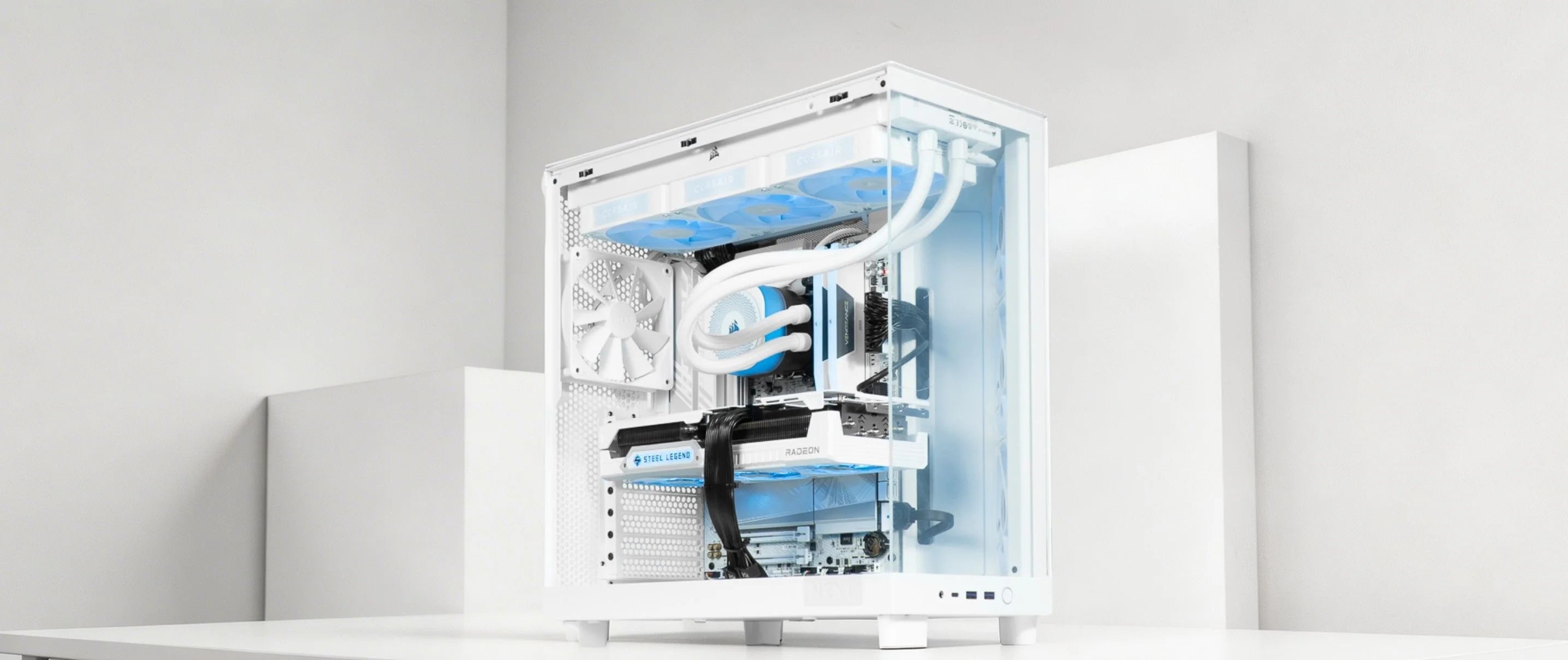 White gaming PC with blue lighting in a bright white setup